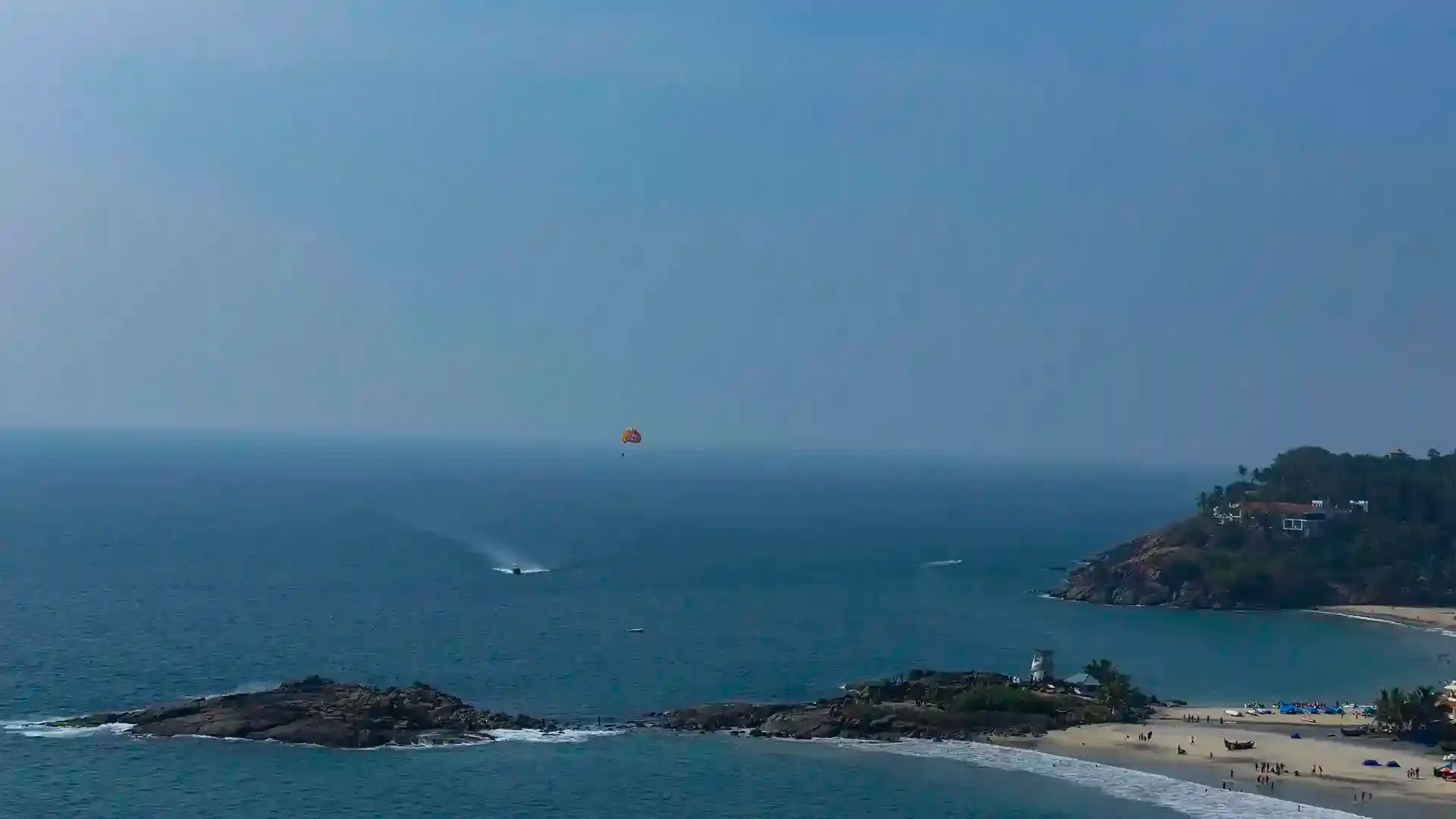 Scenic panoramic view of crescent shaped beaches and adventure sports zones in Kovalam Kerala