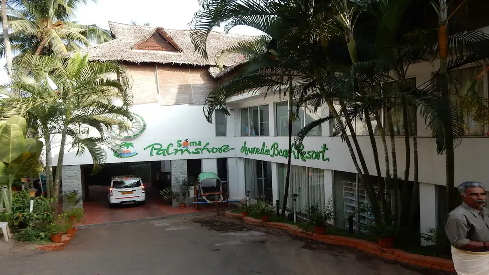 Soma Palmshore Beach Resort building exterior and entrance driveway in Kovalam Kerala