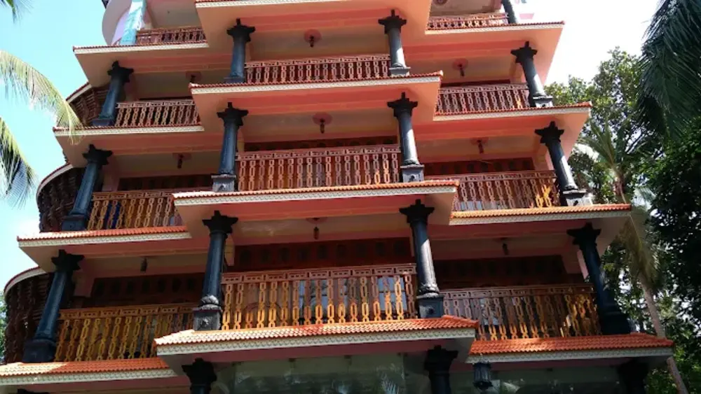 Close-up architectural view of the wooden pillars and terraced balcony floors of Sun Tara Beach Resort Kovalam