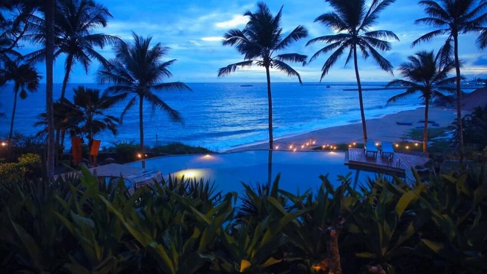 Luxury infinity pool and ocean view at Niraamaya Retreats Surya Samudra resort in Kovalam