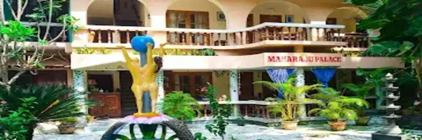 Lush tropical garden entrance and ground floor courtyard of Maharaju Palace Homestay Kovalam