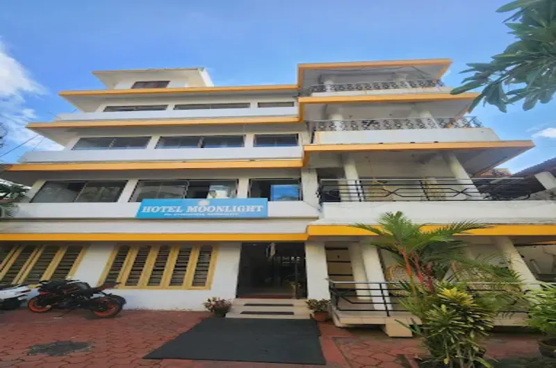 Daytime view of Hotel Moonlight Kovalam building exterior with guest balconies near Palace Junction