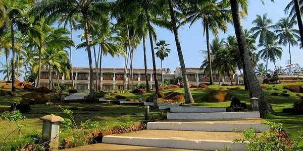 Landscaped gardens and coconut groves at KTDC Samudra beach resort Kovalam.