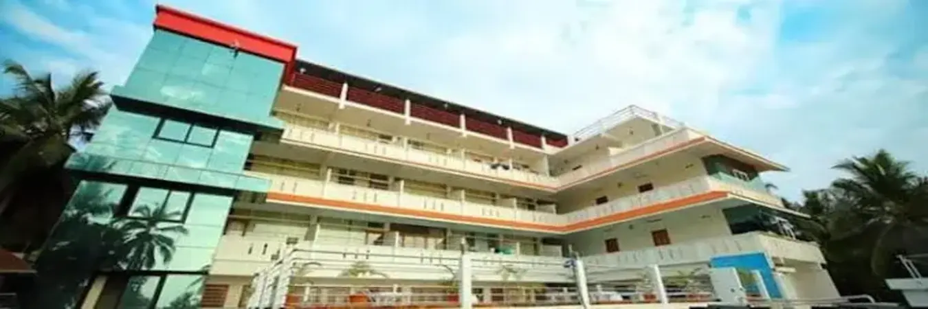 Side profile view of the white terraced balconies at Samudratheeram Beach Resort Kovalam overlooking the ocean