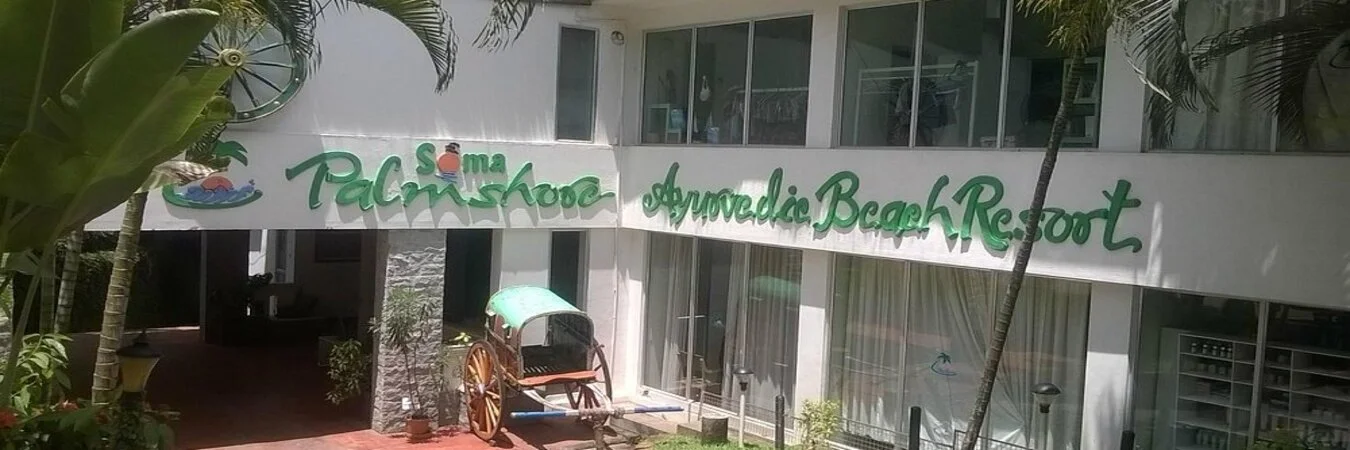 Soma Palmshore Beach Resort exterior building facade with property name sign near Light House Beach Kovalam