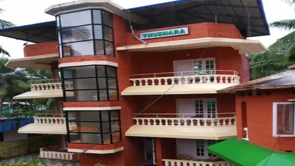 Side profile view of Hotel Thushara building facade near Hawa Beach Kovalam