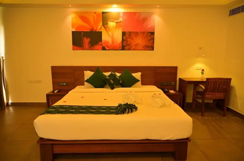 Luxury suite room interior featuring elegant ambient lighting at Aadisaktthi Leisure Resort.