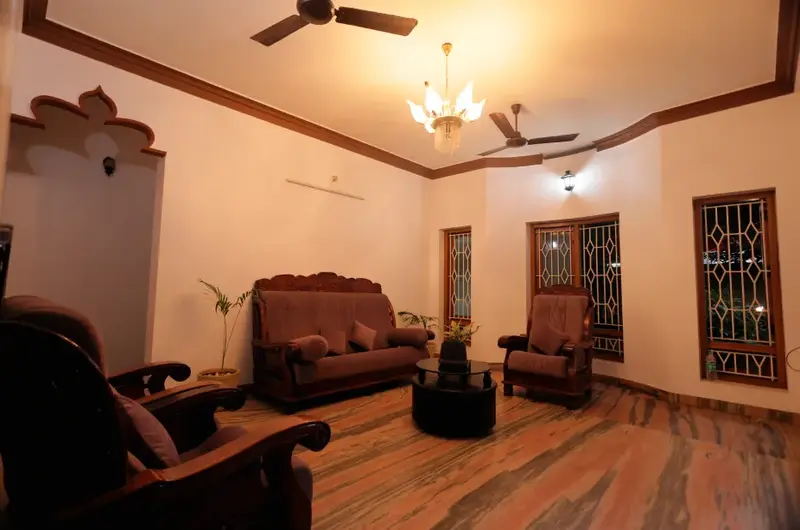 Spaciously designed traditional Kerala style guest living room lounge at Ideal Ayurvedic Resort.