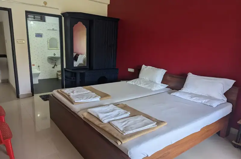 Fully furnished studio apartment bedroom rental with contemporary interiors at Indeevaram Apartments Kovalam.
