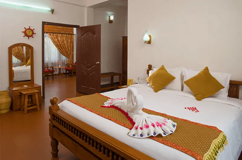 Classic luxury bedroom accommodation with plush bedding at Isola Di Cocco Ayurvedic Beach Resort