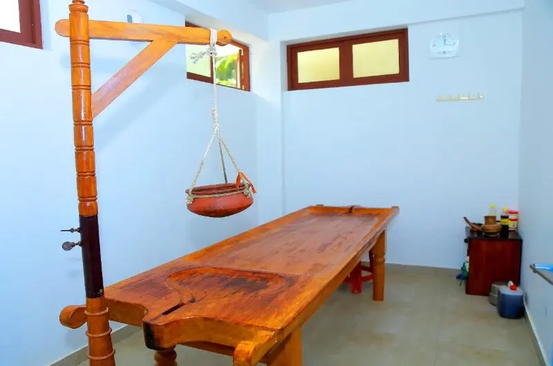 Traditional Ayurvedic massage treatment table room at Little Elephant Beach Resort Kovalam