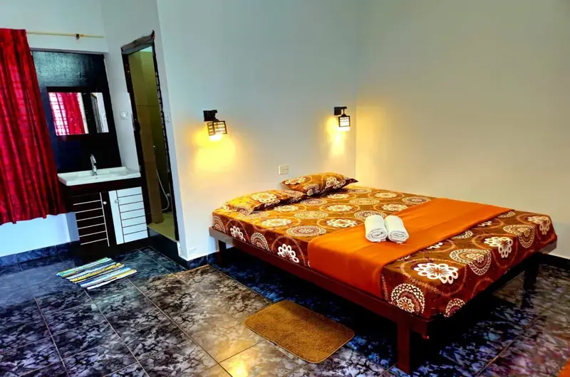 Standard AC guest room interior with cozy bedding at Orion Seaview Beach Resort