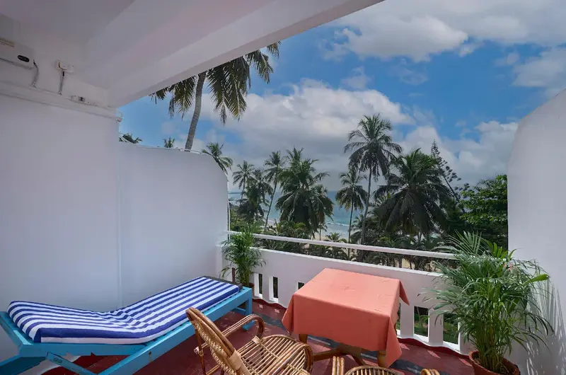 Private guest room balcony featuring panoramic ocean views at Soma Palmshore Beach Resort Kovalam