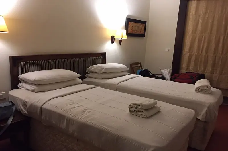 Comfortable twin bed accommodation with modern amenities at Poovar Island Resort Kerala