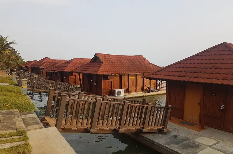 Premium floating villas with private wooden decks on the water at Poovar Island Resort Kerala