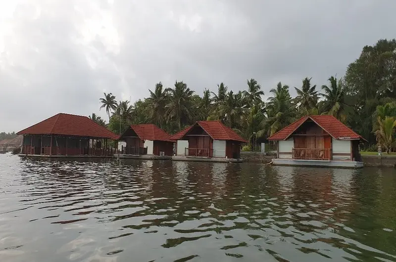 Luxury floating cottages lined up along the serene backwaters at Poovar Island Resort Kerala