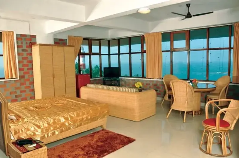 Premium sea view suite room with an attached living area at Sagara Beach Resort Kovalam