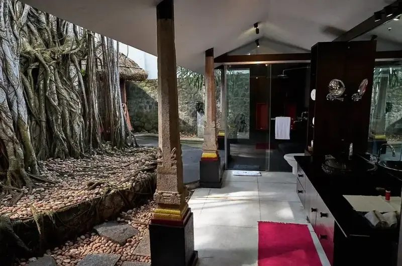 Classic Kerala style heritage corridor with wooden pillars at Niraamaya Retreats Surya Samudra
