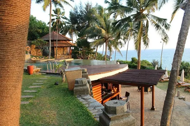 Scenic garden pathway leading to the beach at Niraamaya Retreats Surya Samudra Kovalam