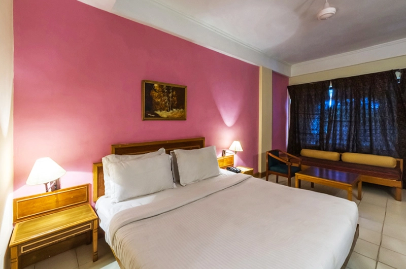 Comfortable deluxe double room accommodation with modern amenities at Swagath Holiday Resort Kovalam