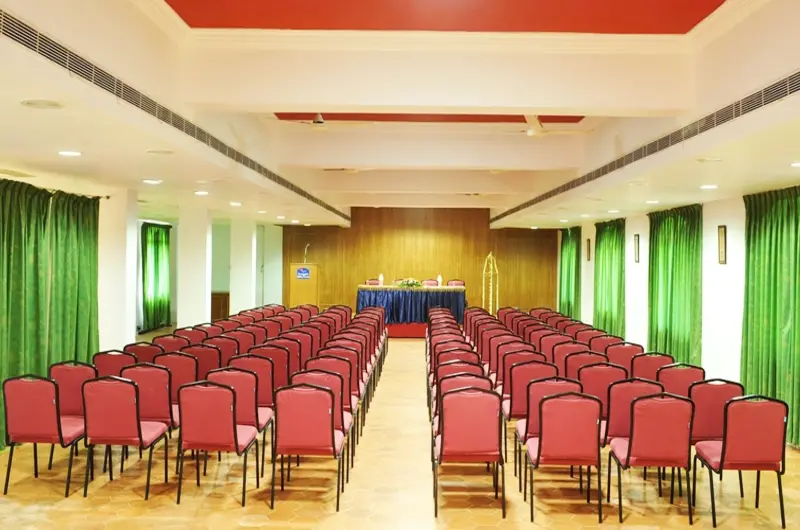 Spacious indoor conference hall and event banquet setup at Swagath Holiday Resort