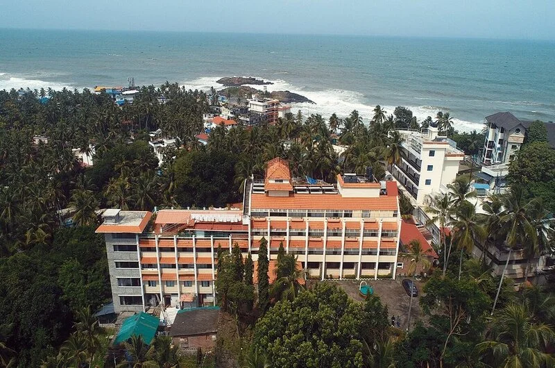 Scenic coastal view of the property nestled in lush greenery at Swagath Holiday Resort