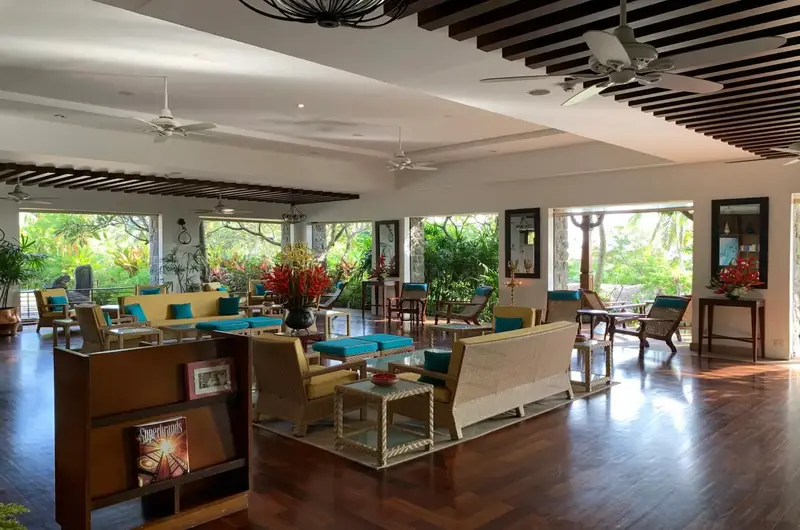 Spacious guest lounge and lobby seating area with modern decor at Taj Green Cove Resort