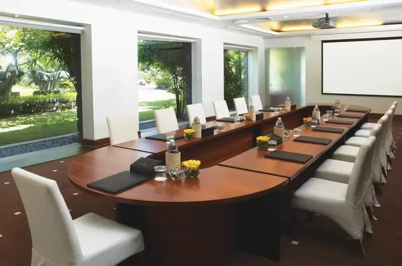 Luxury corporate boardroom and conference table with audio visual setup at Taj Green Cove Resort