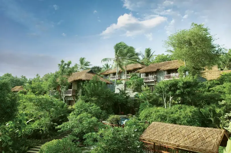 Luxury hillside cottages surrounded by tropical greenery at Taj Green Cove Resort Kovalam