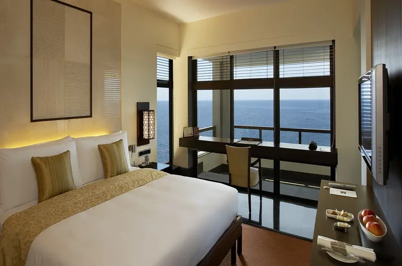 Luxury club room bedroom layout overlooking the Arabian Sea at The Leela Kovalam