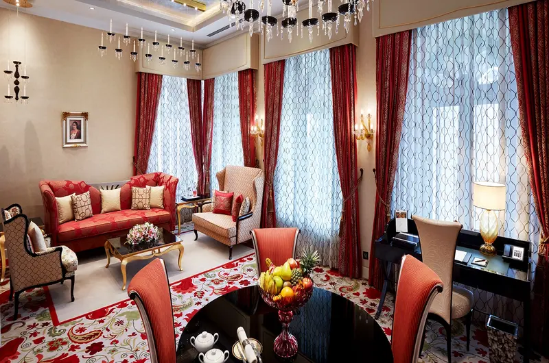 Premium palace suite living area featuring elegant traditional decor at The Leela Kovalam
