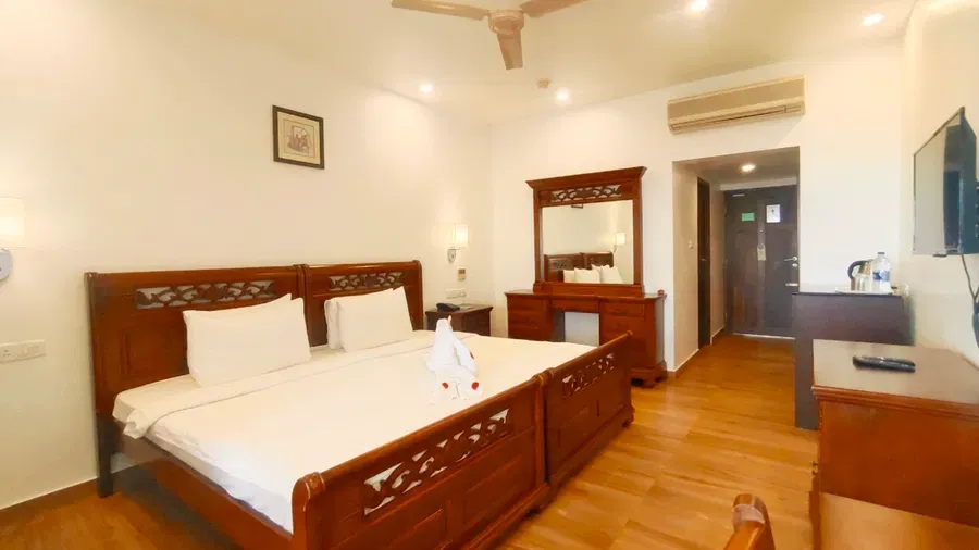 Spacious deluxe double bedroom accommodation at The Travancore Heritage Beach Resort