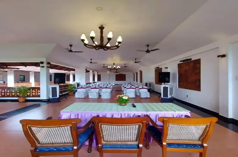 Spacious traditional open air restaurant and dining hall setup at The Travancore Heritage Beach Resort Kovalam