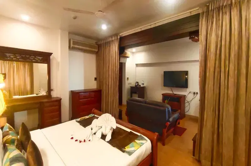 Comfortable AC guest room with authentic heritage design at The Travancore Heritage Beach Resort Kovalam