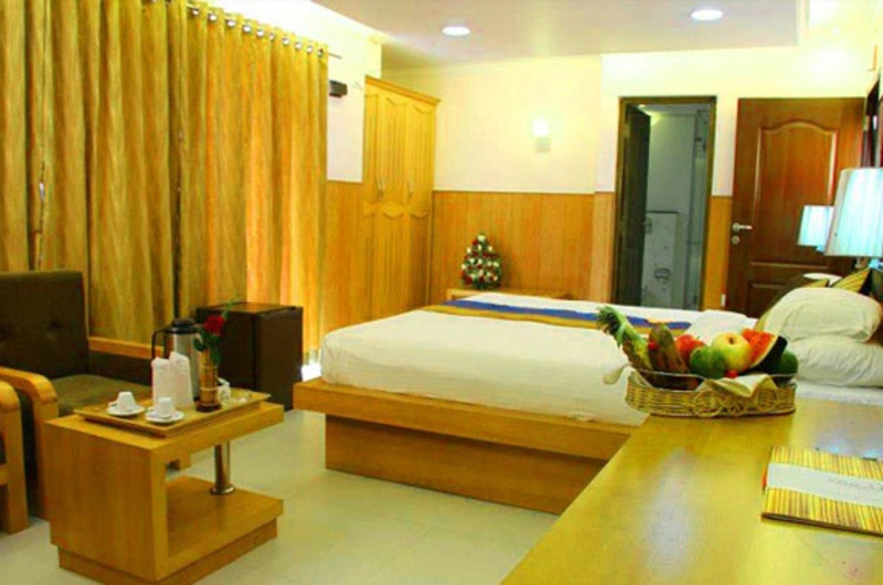 Premium air-conditioned double bedroom accommodation with modern interiors at La Promenade Hotel Kovalam.
