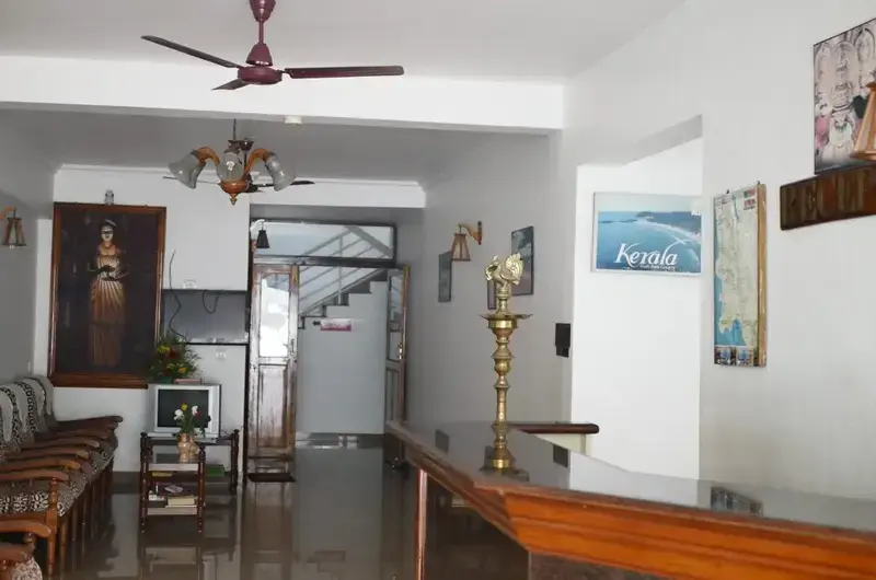 Indoor reception lobby area and guest check-in counter at Hotel Marine Palace Kovalam.