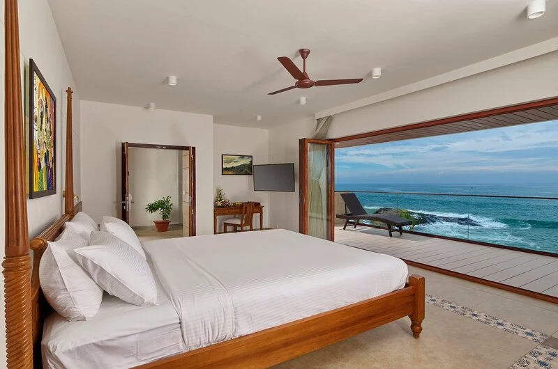 Premium sea view room accommodation with minimalist wooden furniture at Rockholm hotel.
