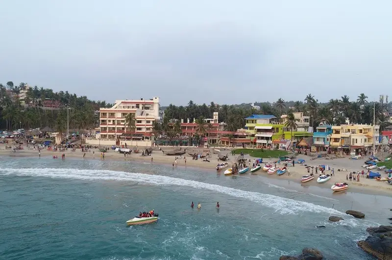 Panoramic view of the sandy coastline and blue ocean from Hotel Sea Face Kovalam.