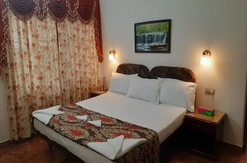 Comfortable budget double bedroom accommodation with modern furnishings at Gokulam Homestay Kovalam.