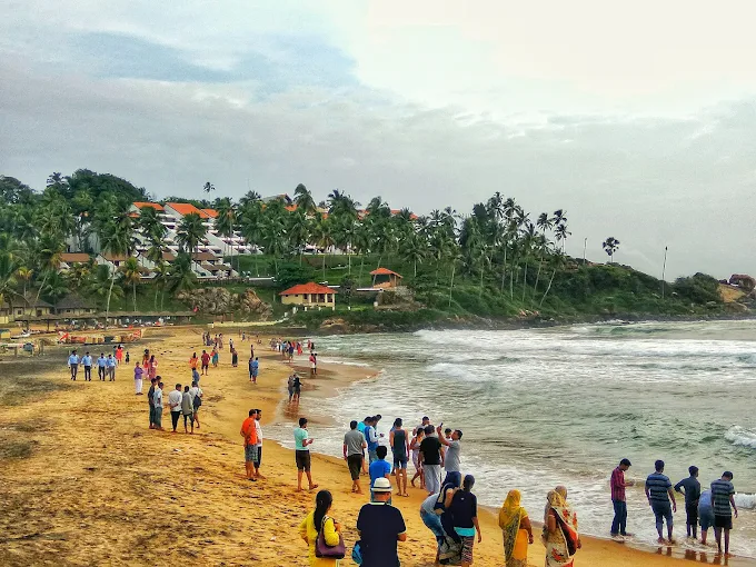 Panoramic view of the sandy Kovalam beach coastline from Samudratheeram Beach Resort premises.