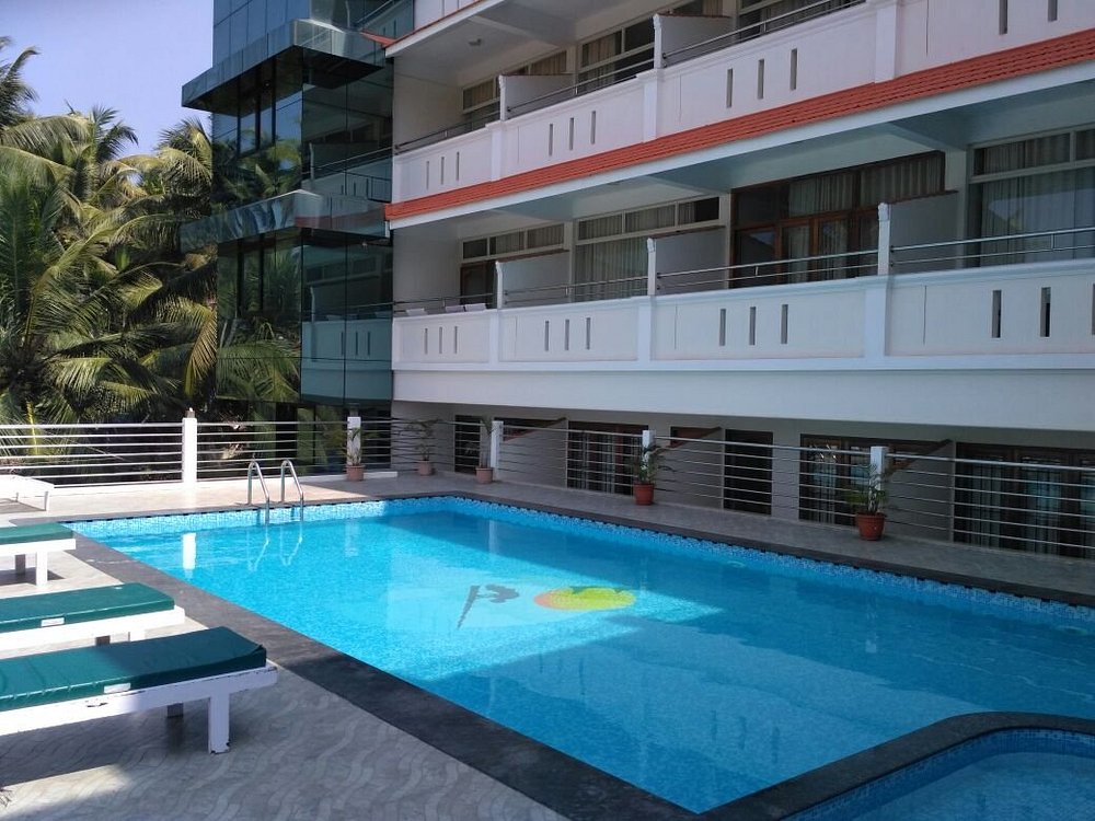 Outdoor swimming pool courtyard at Samudratheeram Beach Resort near Grove Beach Kovalam.