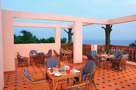 Rooftop restaurant dining terrace with ocean views at Sun Tara Beach Resort