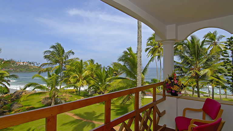 Stunning beach and ocean view from a guest room balcony at Samudra KTDC Kovalam