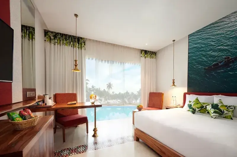 Premium twin bedroom accommodation with garden views at Estuary Island Resort Kovalam