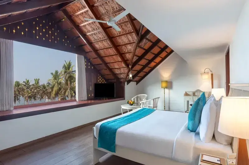 Heritage cottage room with traditional Kerala wooden ceiling at Estuary Island Resort Kovalam