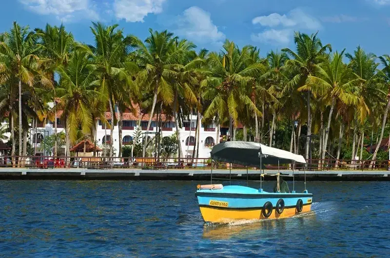 Speedboat cruising on the scenic backwaters at Estuary Island Resort Kerala
