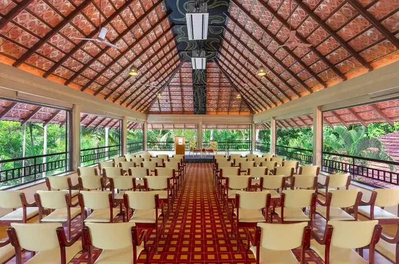 In house restaurant featuring traditional Kerala wooden roof architecture at Estuary Island Resort Kovalam