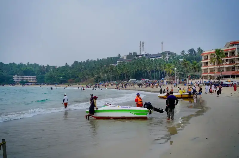 Scenic view of the Kovalam beach and fishing boats near Gods Own Country Ayurveda Resort