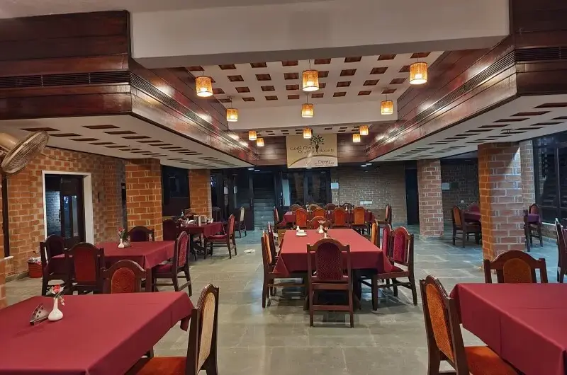 In house multi cuisine restaurant dining area at Gods Own Country Ayurveda Resort