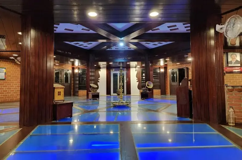 Spacious indoor yoga and meditation hall at Gods Own Country Ayurveda Resort Kovalam